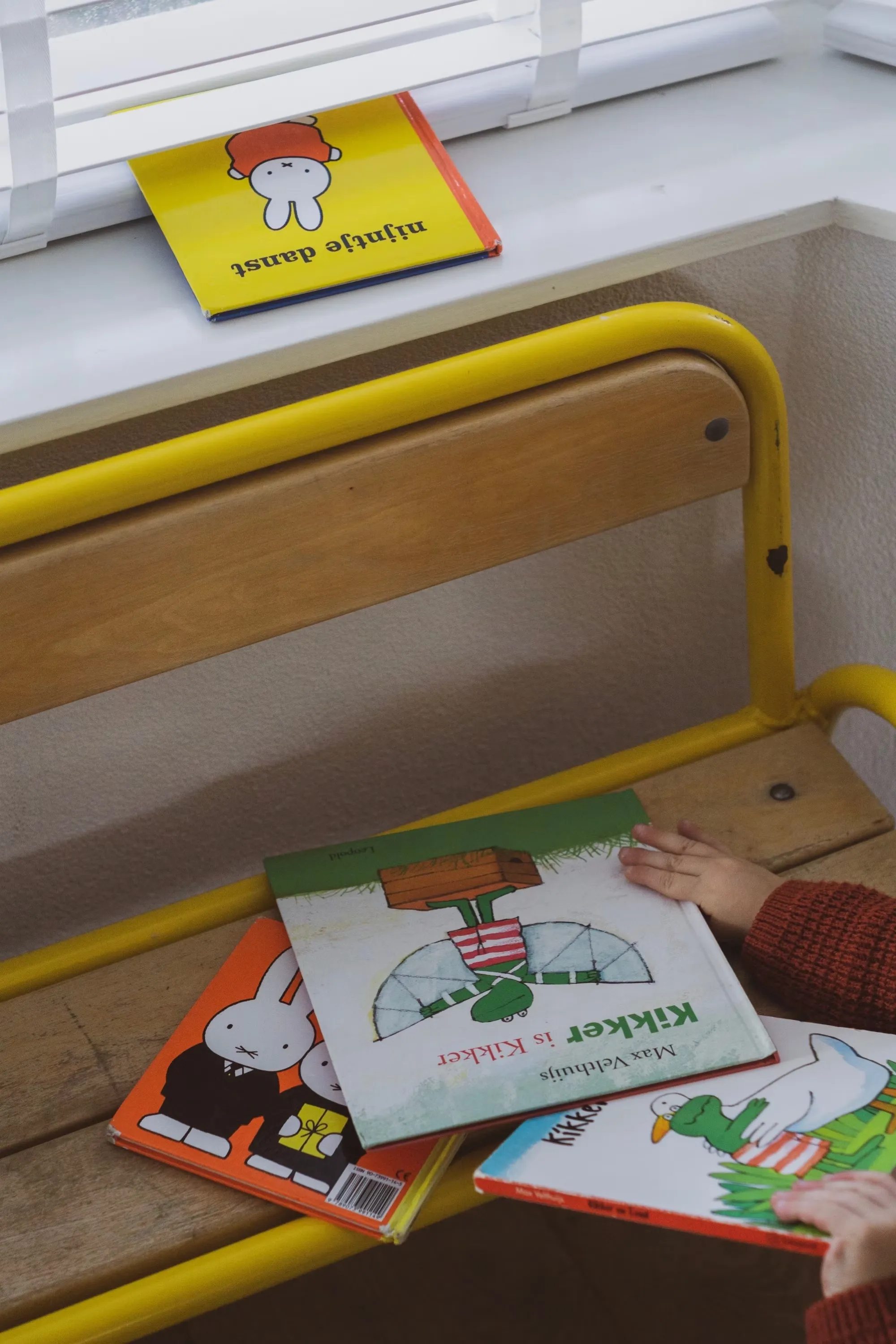 

This image shows a young child playing an interactive story game on a tablet. The child is smiling and engaged in the game, demonstrating the educational and entertaining value of interactive stories for young children.